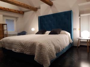 Ένα ή περισσότερα κρεβάτια σε δωμάτιο στο appartamenti e camere Hippy Chic