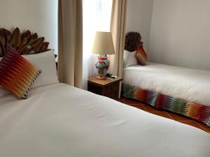 Postel nebo postele na pokoji v ubytování Hotel Spa Posada Tlaltenango