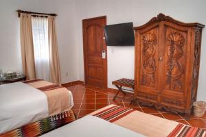 Postel nebo postele na pokoji v ubytování Hotel Spa Posada Tlaltenango