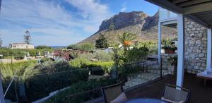 a house with a view of a mountain at Artemis Village Apartments & Studios in Stavros