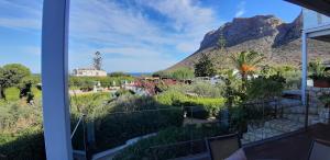 a view from a house with a mountain in the background at Artemis Village Apartments & Studios in Stavros