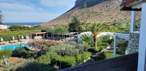 a view of a resort with a mountain in the background at Artemis Village Apartments & Studios in Stavros