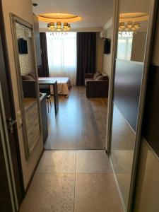 a room with a door leading to a living room at Apartment Elegant in Kyiv +3 photos
