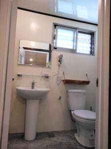 a bathroom with a toilet and a sink at Chentien Changkuang Homestay in Changbin +25 photos