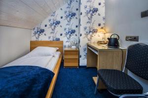 Posteľ alebo postele v izbe v ubytovaní Hotel Zalesie