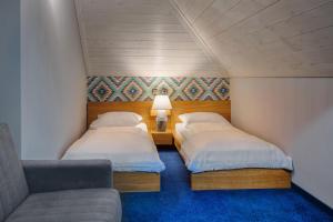 Posteľ alebo postele v izbe v ubytovaní Hotel Zalesie