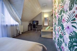 Posteľ alebo postele v izbe v ubytovaní Hotel Zalesie
