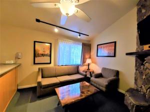 a living room with a couch and a table at Snow Lake Lodge in Big Bear Lake