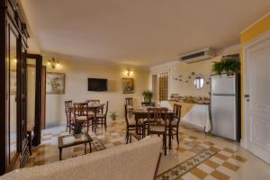 a kitchen and dining room with a table and chairs at Casa Manzella in Terrasini