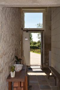 a hallway with a large window and a door at Château de la Garnison in Orvault