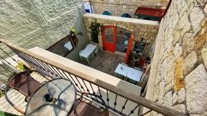 an overhead view of a balcony with a table and benches at Oberj d'Azur Alaçatı in Alaçatı