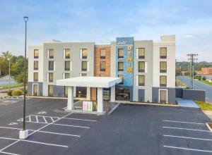 an empty parking lot in front of a hotel at Hotel Denim in Greensboro