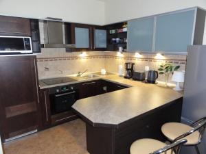 a kitchen with a sink and a counter top at Apartement Basti in Pobierowo