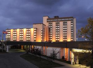 a large building with lights in front of it at Best Western Premier Calgary Plaza Hotel & Conference Centre in Calgary