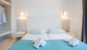Cama o camas de una habitación en Apartamentos Moon Dreams Los Lentiscos