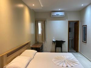 Postel nebo postele na pokoji v ubytování Hotel Sandis