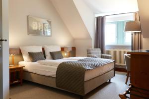 Postel nebo postele na pokoji v ubytování Schloss Hotel Dresden Pillnitz
