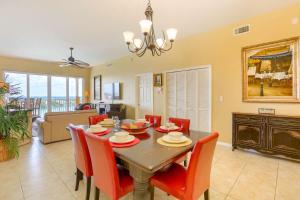 a dining room and living room with a table and chairs at 801 Harborview Grande in Clearwater Beach +36 photos