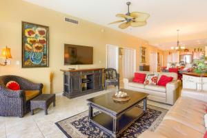 a living room with a couch and a table at 801 Harborview Grande in Clearwater Beach