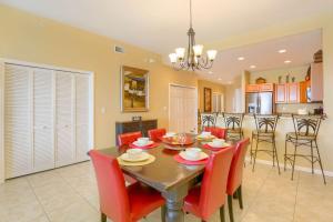 a dining room and kitchen with a table and chairs at 801 Harborview Grande in Clearwater Beach