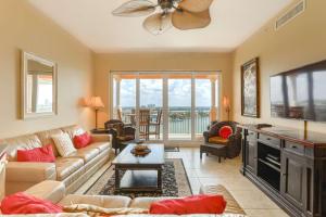 a living room with a couch and a tv at 801 Harborview Grande in Clearwater Beach