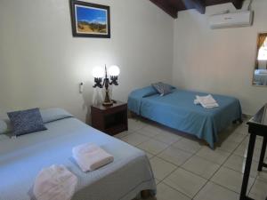Ένα ή περισσότερα κρεβάτια σε δωμάτιο στο Hotel Posada Comala
