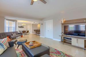 a living room with a large flat screen tv at Sun & Sea C300 in Clearwater Beach