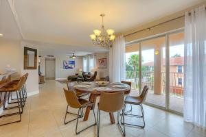 a dining room and living room with a table and chairs at Sun & Sea C300 in Clearwater Beach