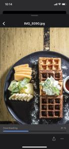 a picture of a plate of waffles and waffles at Hotel Riazor in Santo Domingo