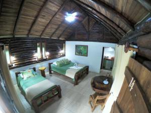 uma vista sobre um quarto com uma cama e um sofá em Arenal Oasis Eco Lodge & Wildlife Refuge em Fortuna