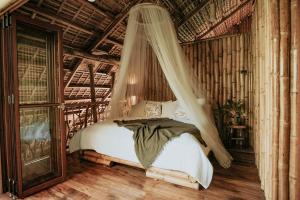 Ένα ή περισσότερα κρεβάτια σε δωμάτιο στο Treehouse de Valentine
