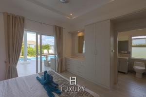 a bedroom with a blue elephant on a bed at Modern 3 Bedroom Private Pool Villa - MP67 in Hua Hin +52 photos