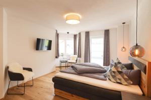 Televízia a/alebo spoločenská miestnosť v ubytovaní Appartements Seven Summits