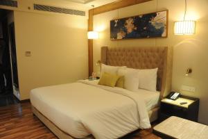 Ένα ή περισσότερα κρεβάτια σε δωμάτιο στο Maryland Group Hotel +70 φωτογραφίες