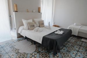 Łóżko lub łóżka w pokoju w obiekcie Hostal Vidamia