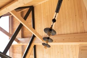 a chandelier hanging from the ceiling of a building at Chalets Na'Thur lodge in Fellering