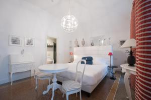 Кровать или кровати в номере Hotel Marina Charming Rooms