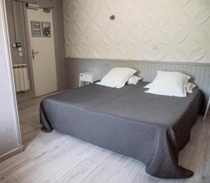 Postel nebo postele na pokoji v ubytování Hotel Beau Rivage