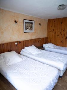 Postel nebo postele na pokoji v ubytování Hotel Beau Rivage