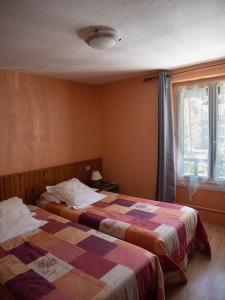 Postel nebo postele na pokoji v ubytování Hotel Beau Rivage