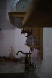 a close up of a kitchen counter with a sink at Casa rural fuentelgato in Huerta del Marquesado
