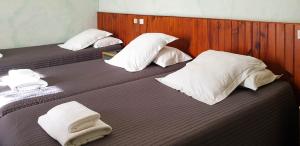 Postel nebo postele na pokoji v ubytování Hotel Beau Rivage