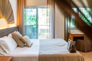 Postel nebo postele na pokoji v ubytování Hotel Rex