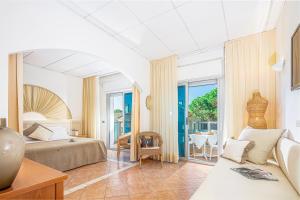 Postel nebo postele na pokoji v ubytování Hotel Rex