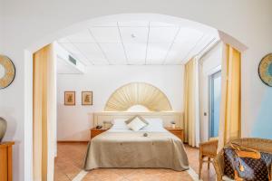 Postel nebo postele na pokoji v ubytování Hotel Rex