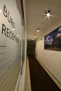 a hallway of a building with a sign on the wall at Chalet Gonda inklusive Premiumcard in Galtür