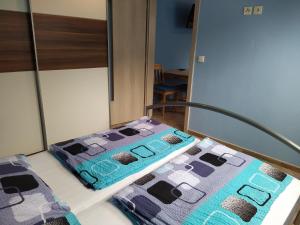 Postel nebo postele na pokoji v ubytování Apartments Klentnice U Mikulova