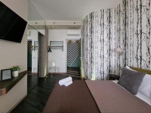Postel nebo postele na pokoji v ubytování 15 Quindici by Serendipity Rooms