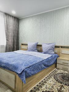 Postel nebo postele na pokoji v ubytování ApartLux on Slavskogo 14