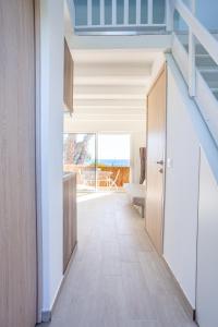 a hallway of a house with a staircase at Appartement Marineland Sea View in Antibes